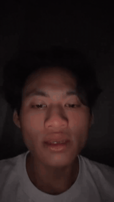 Close Up Of Man's Face In White Shirt GIF