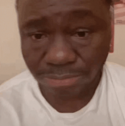 Close Up Of Man's Face In White Shirt GIF