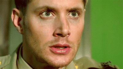 Close Up Of Man's Face On Green Background GIF