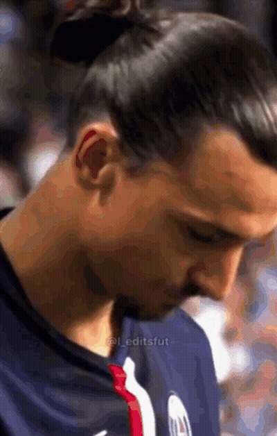 Close Up Of Man's Face With A Bun GIF
