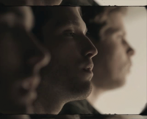 Close Up Of Man's Face With Another Man In Background GIF