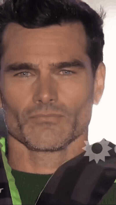 Close Up Of Man's Face With Badge GIF