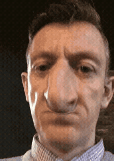 Close Up Of Man's Face With Big Nose GIF