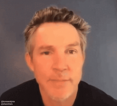 Close Up Of Man's Face With Blue Background GIF