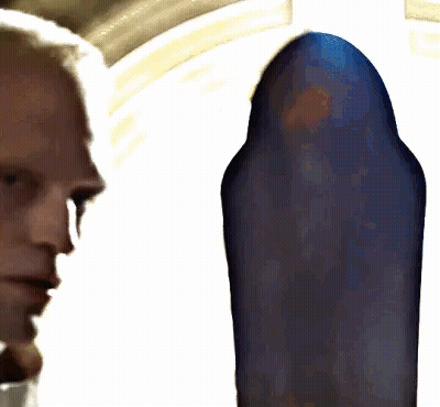 Close Up Of Man's Face With Blue Background GIF
