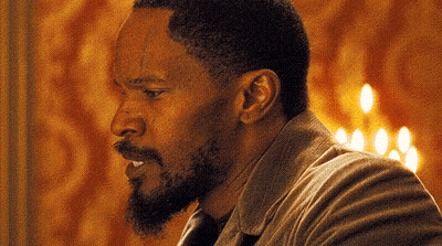 Close Up Of Man's Face With Candles GIF