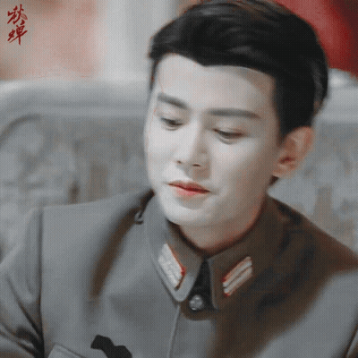 Close Up Of Man's Face With Chinese Writing GIF