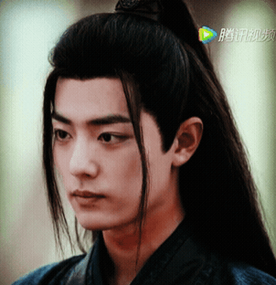 Close Up Of Man's Face With Chinese Writing GIF