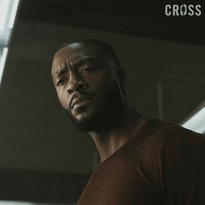 Close Up Of Man's Face With Cross GIF