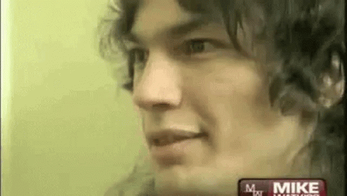 Close Up Of Man's Face With Curly Hair GIF