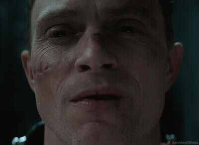 Close Up Of Man's Face With Daredevil Shots Logo GIF