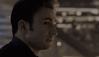 Close Up Of Man's Face With Dark Background GIF
