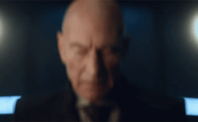 Close Up Of Man's Face With Dark Background GIF