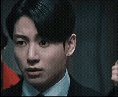 Close Up Of Man's Face With Ear Piercing GIF