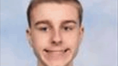 Close Up Of Man's Face With Green Object In Mouth GIF