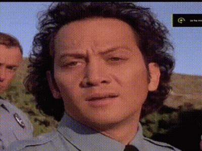 Close Up Of Man's Face With Letter G GIF