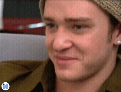 Close Up Of Man's Face With Letter N GIF
