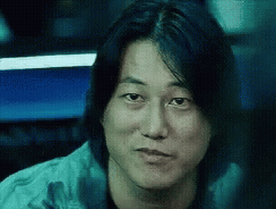 Close Up Of Man's Face With Long Black Hair GIF