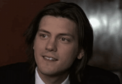Close Up Of Man's Face With Long Hair GIF