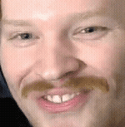 Close Up Of Man's Face With Mustache And Teeth GIF