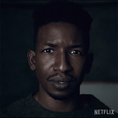 Close Up Of Man's Face With Netflix Logo GIF