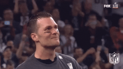 Close Up Of Man's Face With NFL Logo In Background GIF