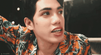 Close Up Of Man's Face With Number 19 GIF