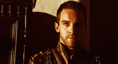 Close Up Of Man's Face With Shadow On Wall GIF