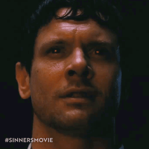 Close Up Of Man's Face With Sinners Movie Hashtag GIF