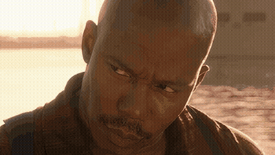 Close Up Of Man's Face With Sun Behind GIF