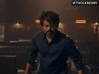 Close Up Of Man's Face With Twitter Username 7Wickreddy GIF