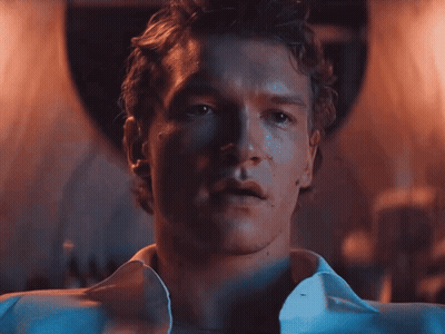 Close Up Of Man's Face With White Shirt Open GIF