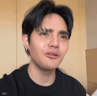 Close Up Of Man's Face With Zky Watermark GIF