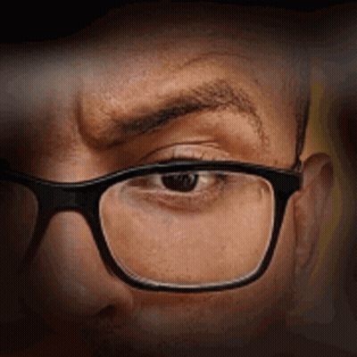 Close Up Of Man Wearing Glasses Making Funny Face GIF
