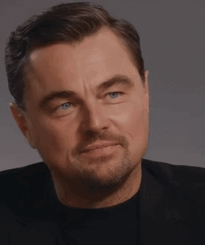 Close Up Of Man With Beard In Black Shirt And Suit GIF