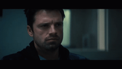 Close Up Of Man With Beard In Dark Room GIF