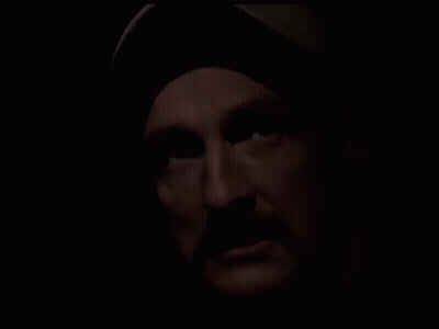 Close Up Of Man With Beard In Dark GIF