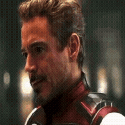 Close Up Of Man With Beard In Superhero Suit GIF