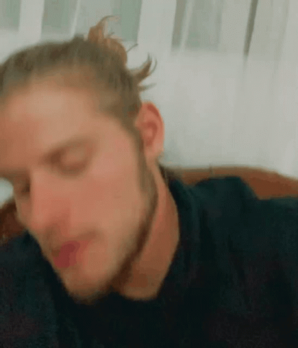 Close Up Of Man With Bun On Hair GIF
