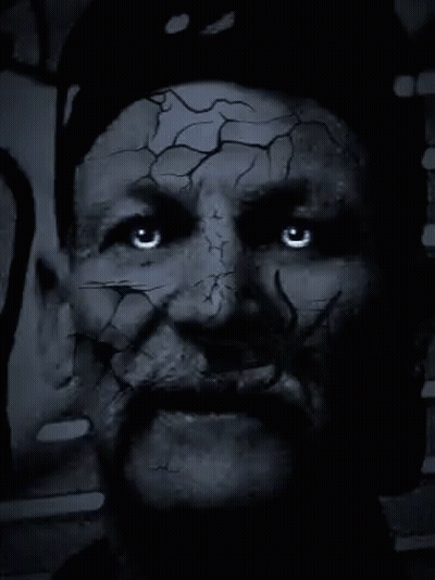 Close Up Of Man With Cracked Face And Beard GIF