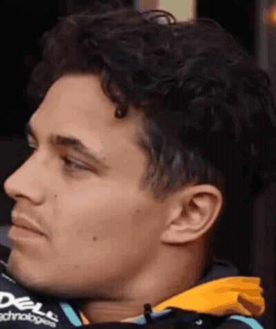 Close Up Of Man With Curly Hair In Jacket GIF