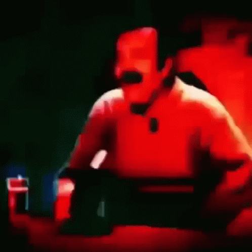 Close Up Of Man With Mustache Laughing In Red Light GIF