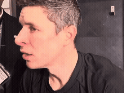 Close Up Of Man With Name Tag Saying G GIF