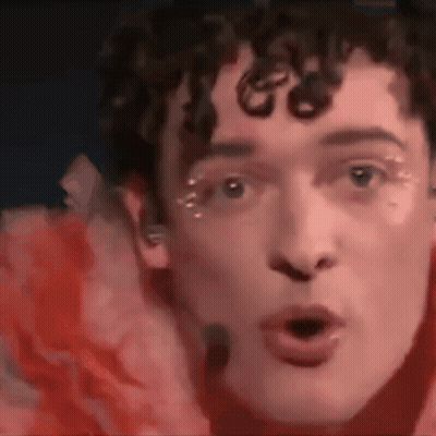 Close Up Of Man With Red Flower GIF
