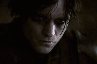 Close Up Of Man With Serious Look In Dark Room GIF