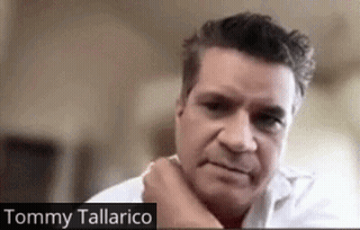 Close Up Of Man With Tommy Tallarico Written Below GIF