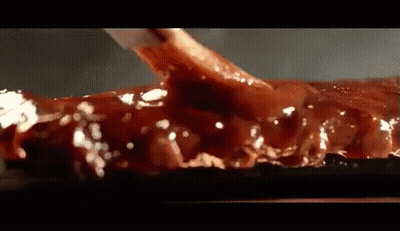 Close Up Of Meat Covered In Sauce GIF