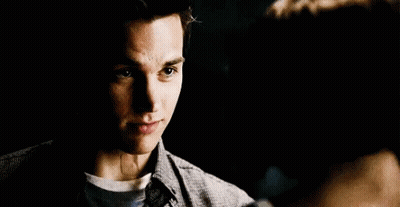 Close Up Of Men In Dark Room GIF