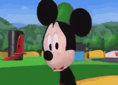 Close Up Of Mickey Mouse Face In Park GIF