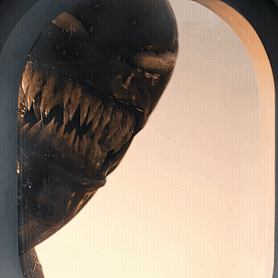 Close Up Of Monster Statue With Large Mouth GIF
